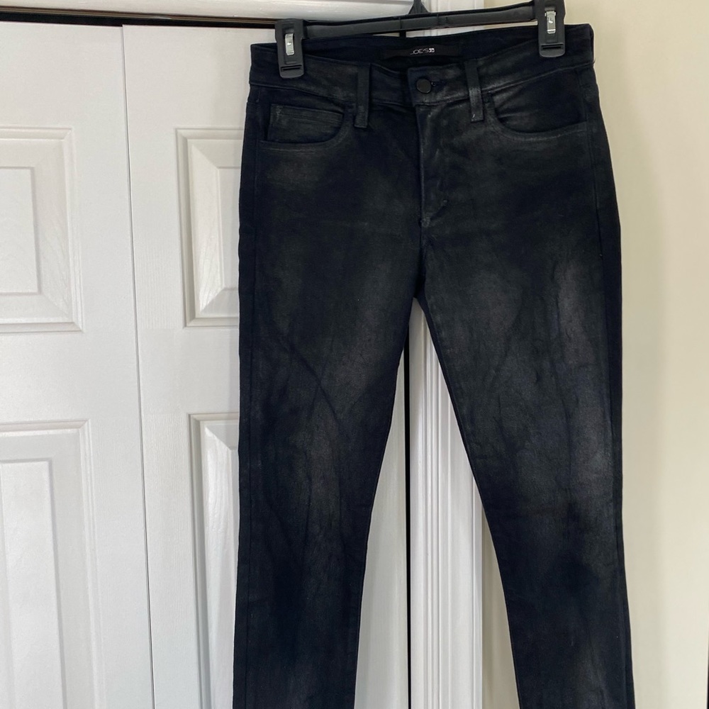 Woman’s black jeans (with a sheen) by Joe’s is a size 26 and length 29 inches.